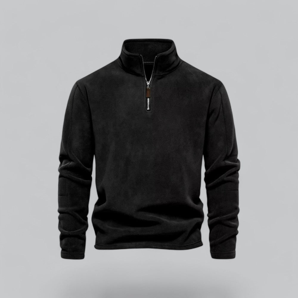 Black quarter-zip sweatshirt on a gray background