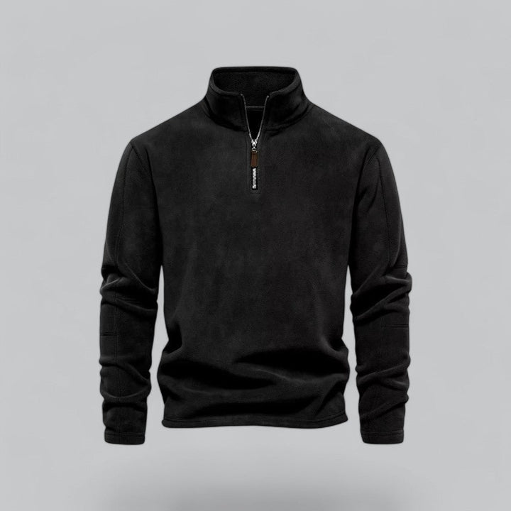 Black quarter-zip sweatshirt on a gray background