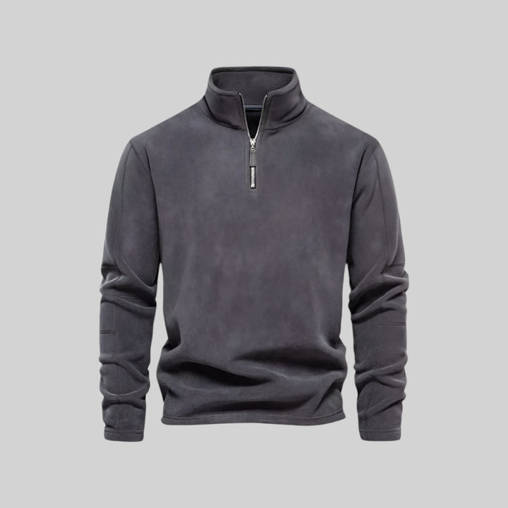 Gray fleece pullover with a quarter zip on a light gray background