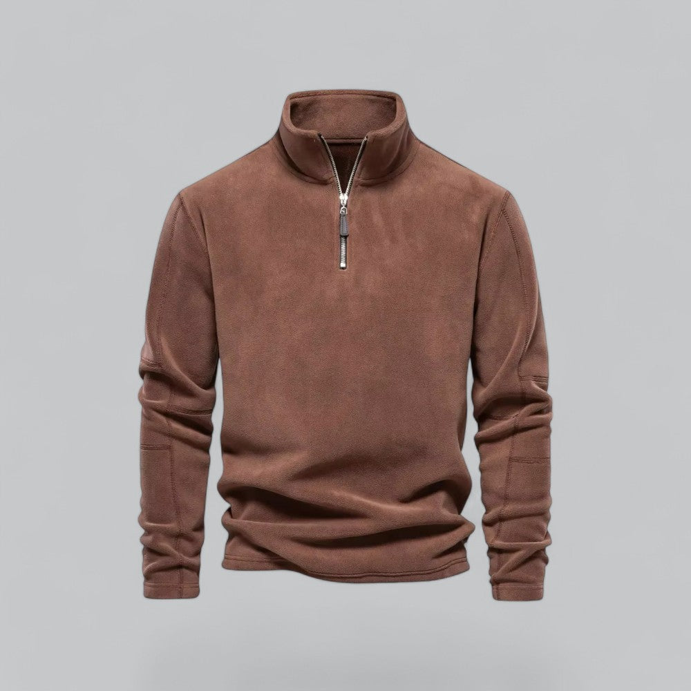 Brown fleece pullover with a zipper on a gray background