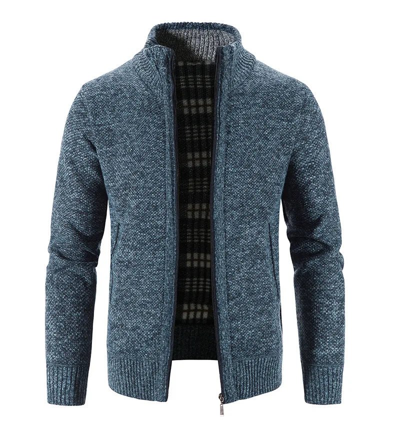 Blue knitted cardigan with plaid lining on a white background