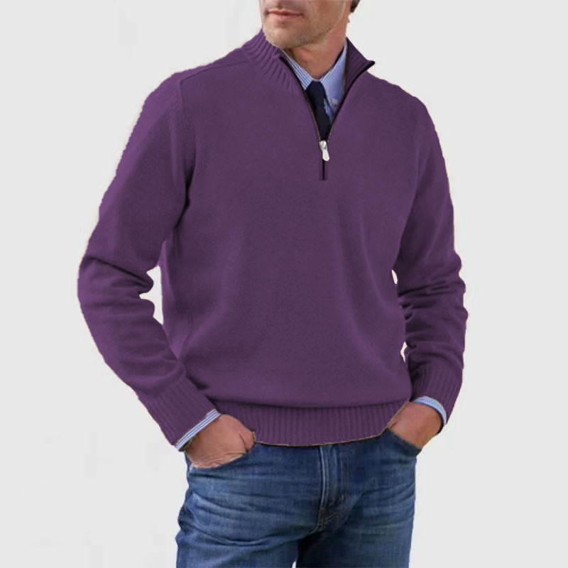 Man wearing a purple sweater with a zipper on a white background