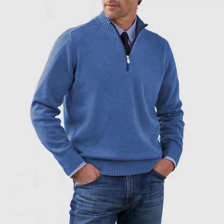 Man wearing a blue sweater with a white background