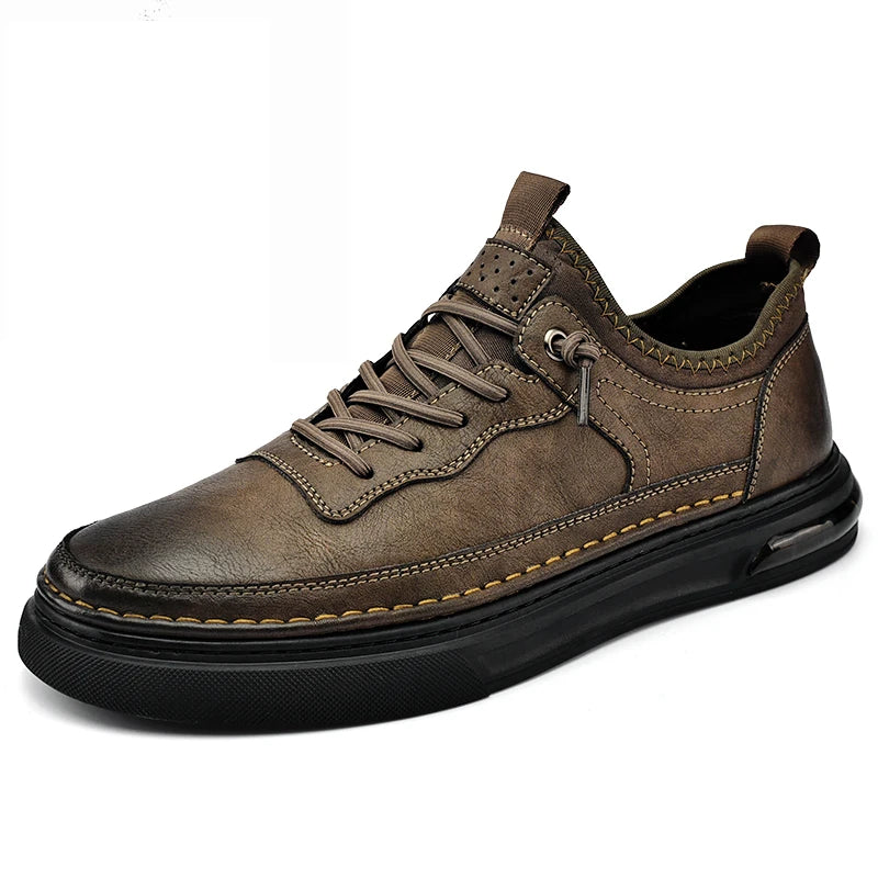 Brown leather shoe with black sole on a white background