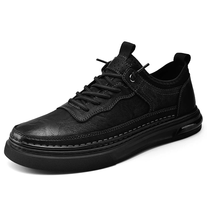Black leather sneaker on a white background