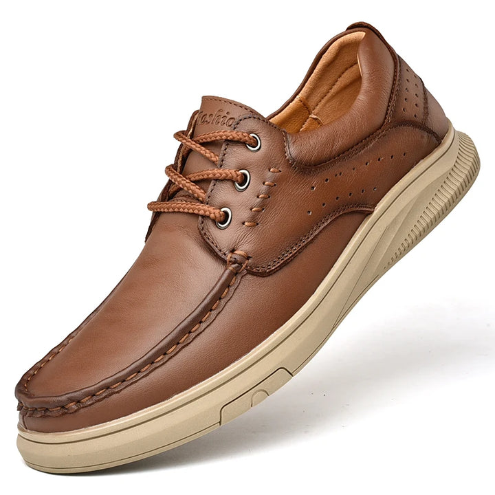 Brown leather shoe with beige sole on a white background
