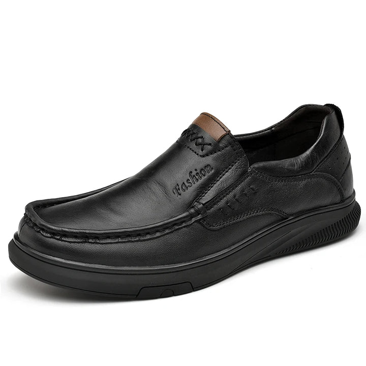 Black leather shoe on a white background