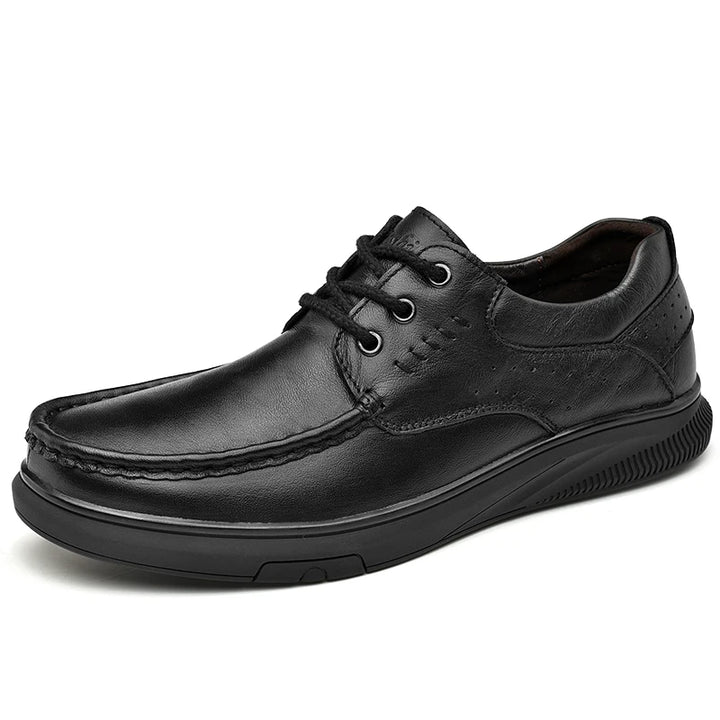 Black leather shoe on a white background