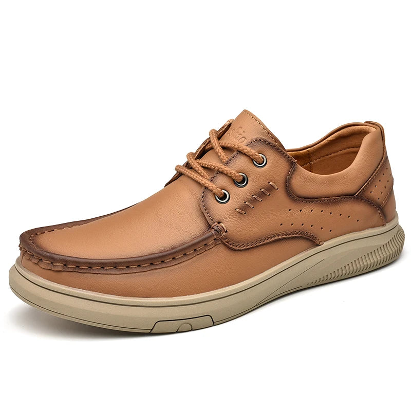 Tan leather shoe with brown accents on a white background