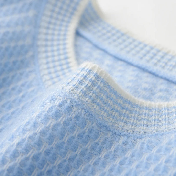 Close-up of blue textured fabric with a white border