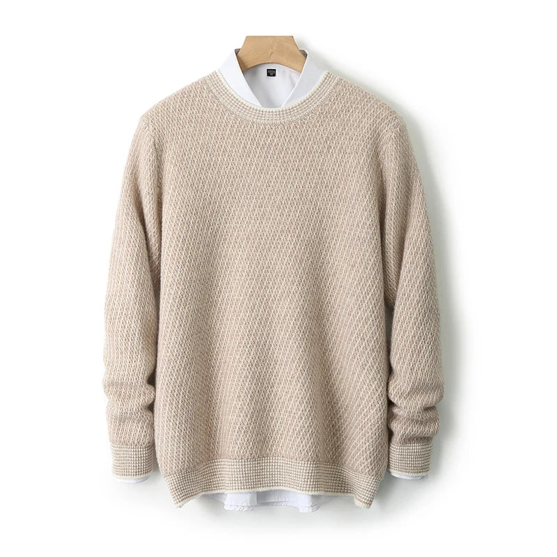 Beige sweater on a wooden hanger against a white background