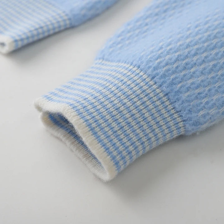 Close-up of blue and white striped fabric on a light gray background