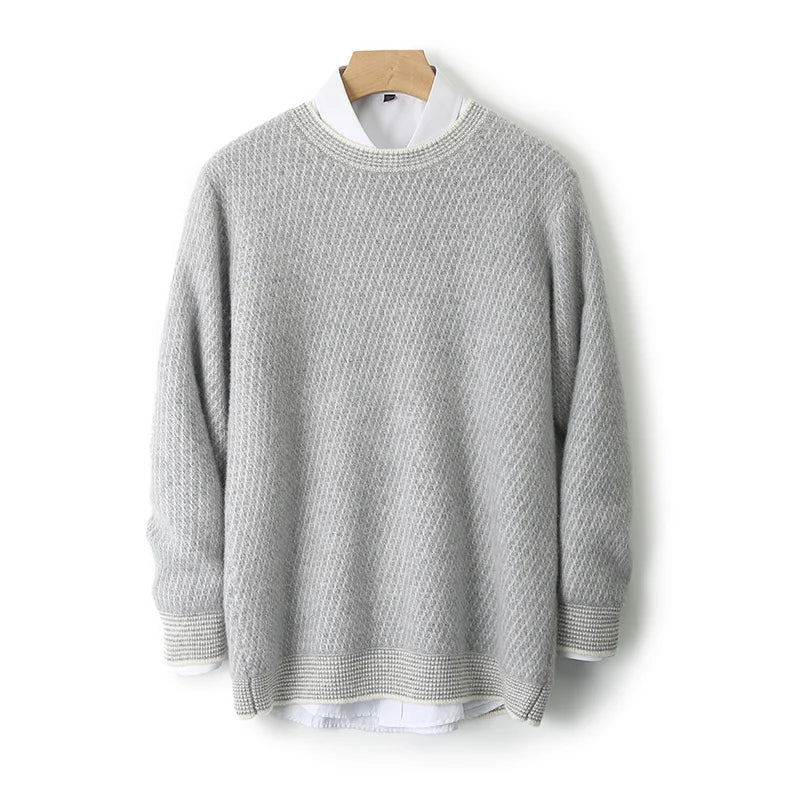 Gray sweater on a wooden hanger against a white background
