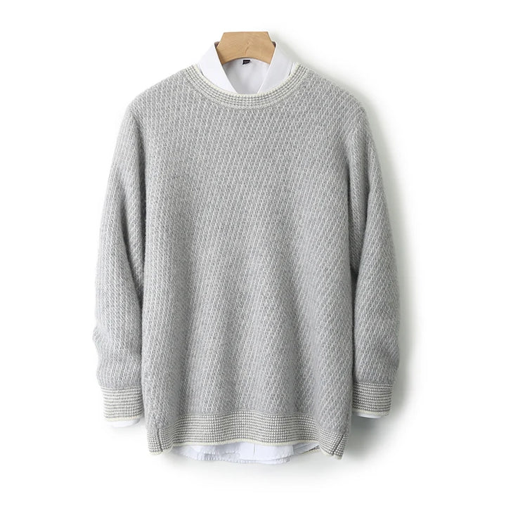 Gray sweater on a wooden hanger against a white background