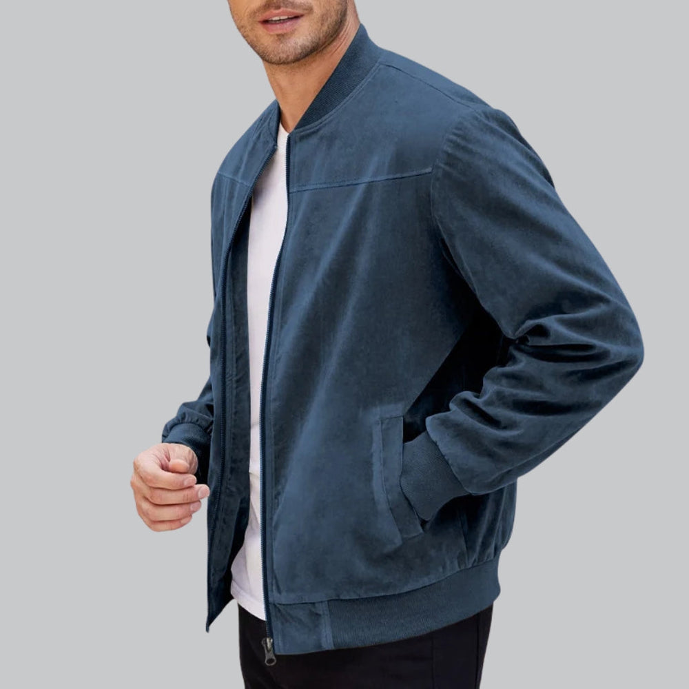 Man wearing a blue jacket on a gray background