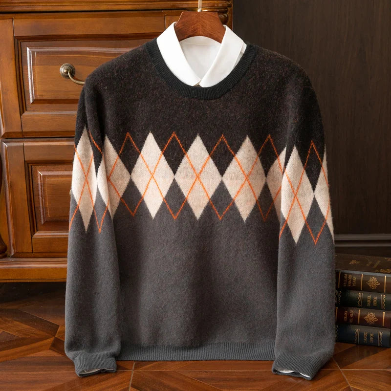 Brown argyle sweater on a wooden hanger against a dark wooden cabinet background