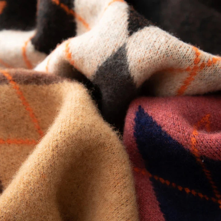 Close-up of plaid fabric in various colors.