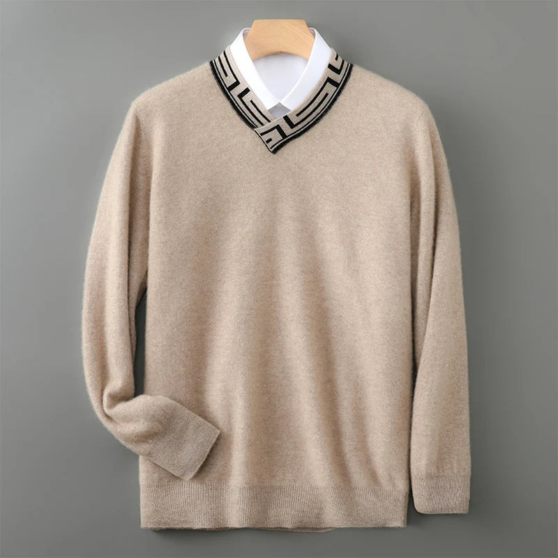 Beige sweater with a patterned collar on a gray background