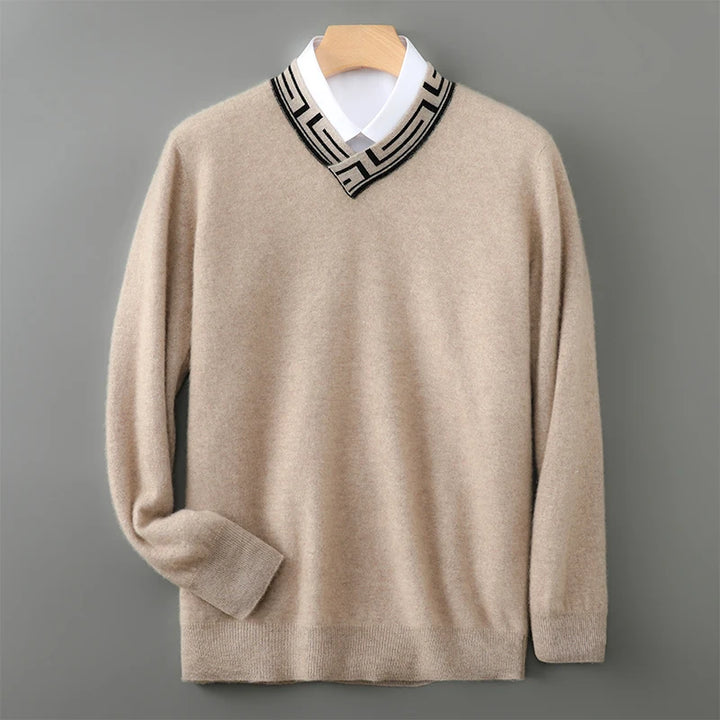Beige sweater with a patterned collar on a gray background