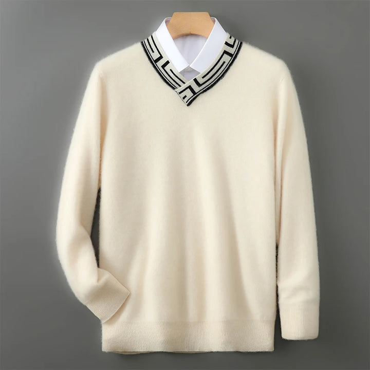 Beige sweater with a patterned collar on a gray background