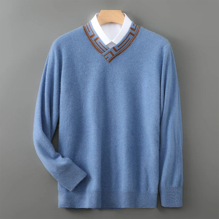 Blue sweater with a brown collar on a gray background
