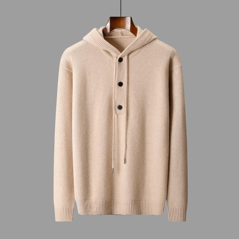 Beige hoodie with button details on a gray background