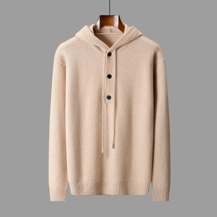 Beige hoodie with button details on a gray background