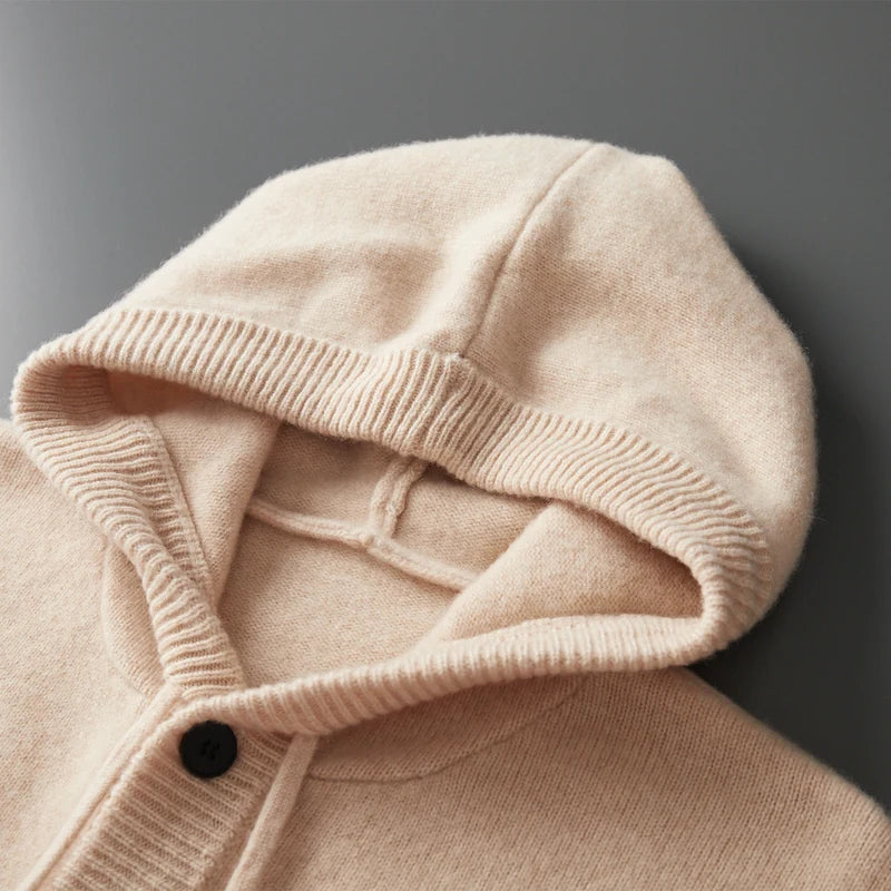 Close-up of a beige hooded garment with a dark background
