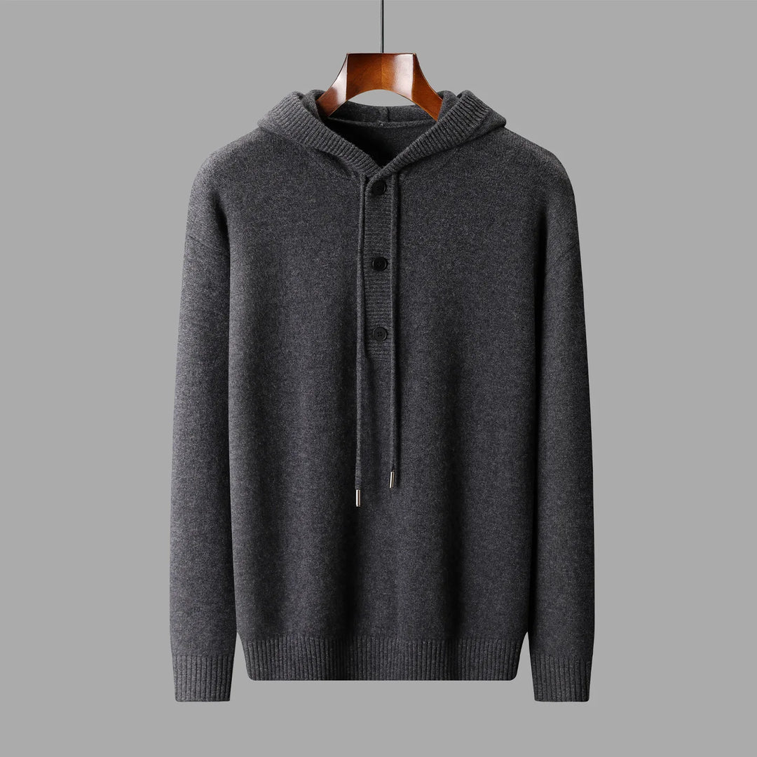Gray hoodie on a hanger against a gray background