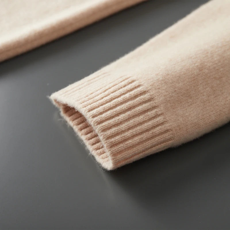 Close-up of beige knitted fabric on a dark surface