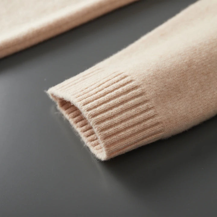 Close-up of beige knitted fabric on a dark surface