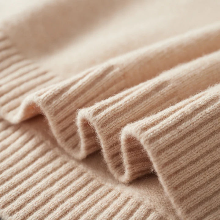 Close-up of a beige ribbed sweater fabric