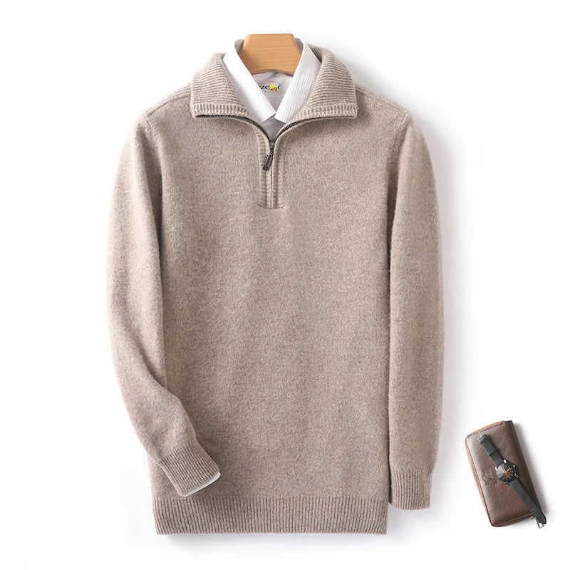 Beige sweater with a white shirt underneath on a hanger, with a brown leather wallet beside it.