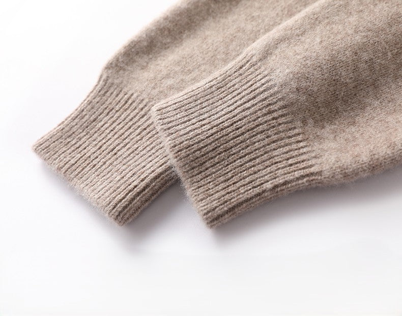 Close-up of beige knitted sleeves on a white background