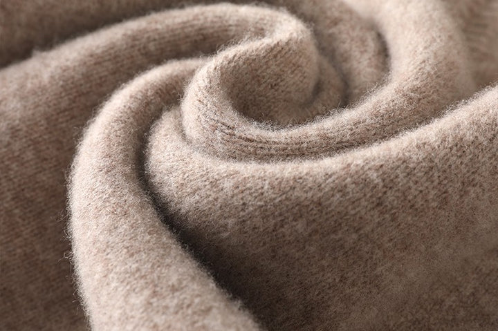Close-up of a rolled-up beige fabric texture
