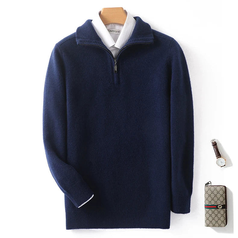 Navy blue sweater with white collar on a wooden hanger, next to a Gucci wallet and watch on a white background