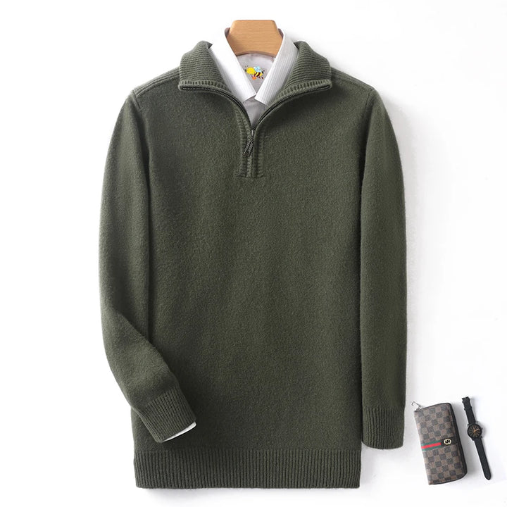 Green sweater on a mannequin with a white shirt underneath, on a light gray background.