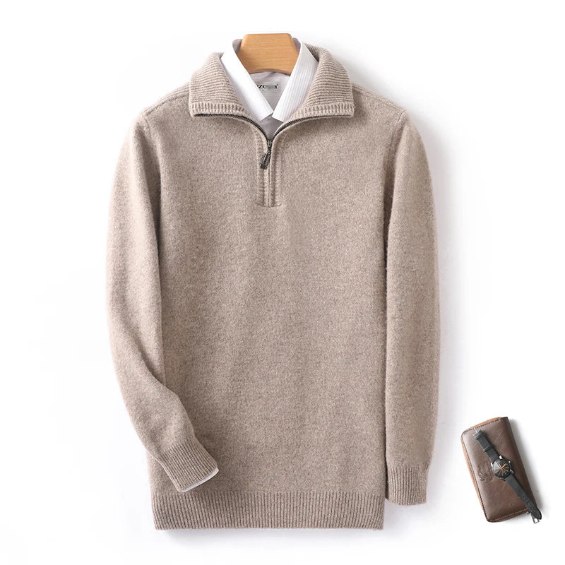 Beige sweater with a white shirt collar on a hanger against a white background