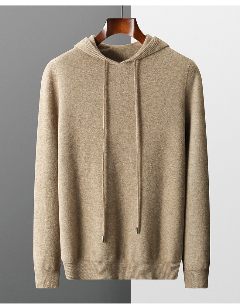 Beige hoodie on a hanger against a neutral background