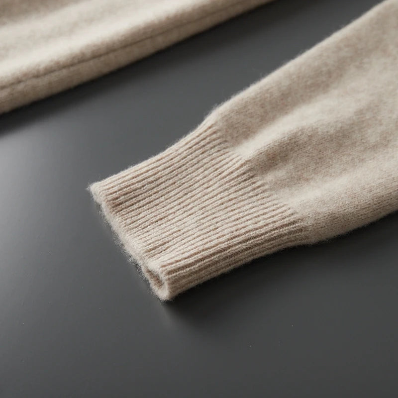 Close-up of beige knitted fabric on a dark surface