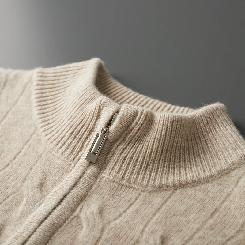 Close-up of a beige sweater with a zipper on a gray background