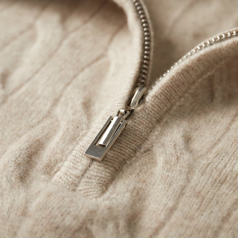 Close-up of a beige sweater with a zipper