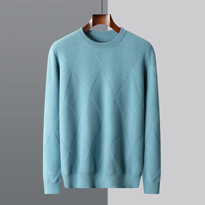 Blue sweater on a hanger against a gray background