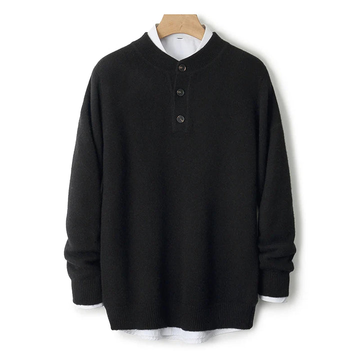 Black long-sleeve shirt with buttons on a wooden hanger against a white background
