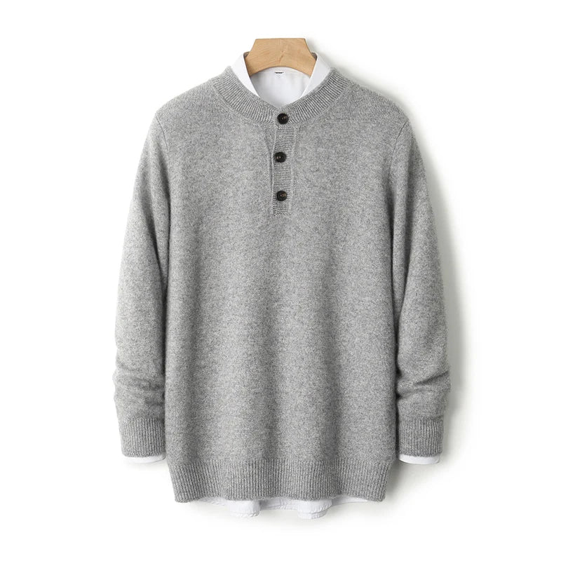Gray sweater on a wooden hanger against a white background