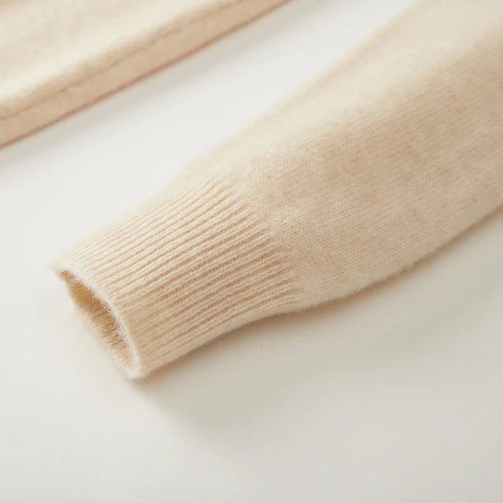 Close-up of beige knitted fabric on a light background