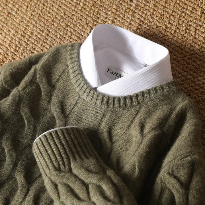 Green sweater with a white shirt collar and 'Fazey' label on a textured brown background