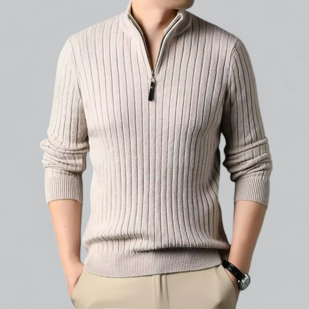 Beige ribbed sweater with a zipper on a gray background