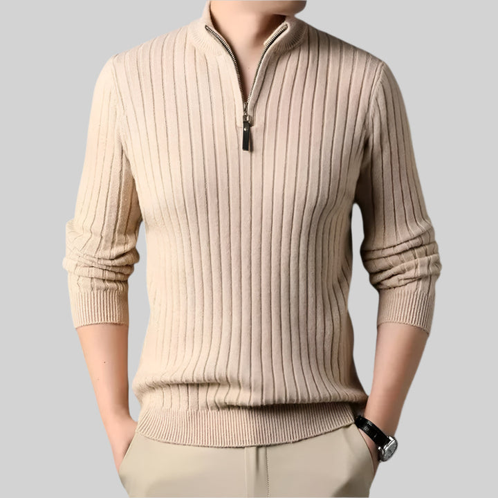 Beige ribbed sweater with a zipper on a gray background