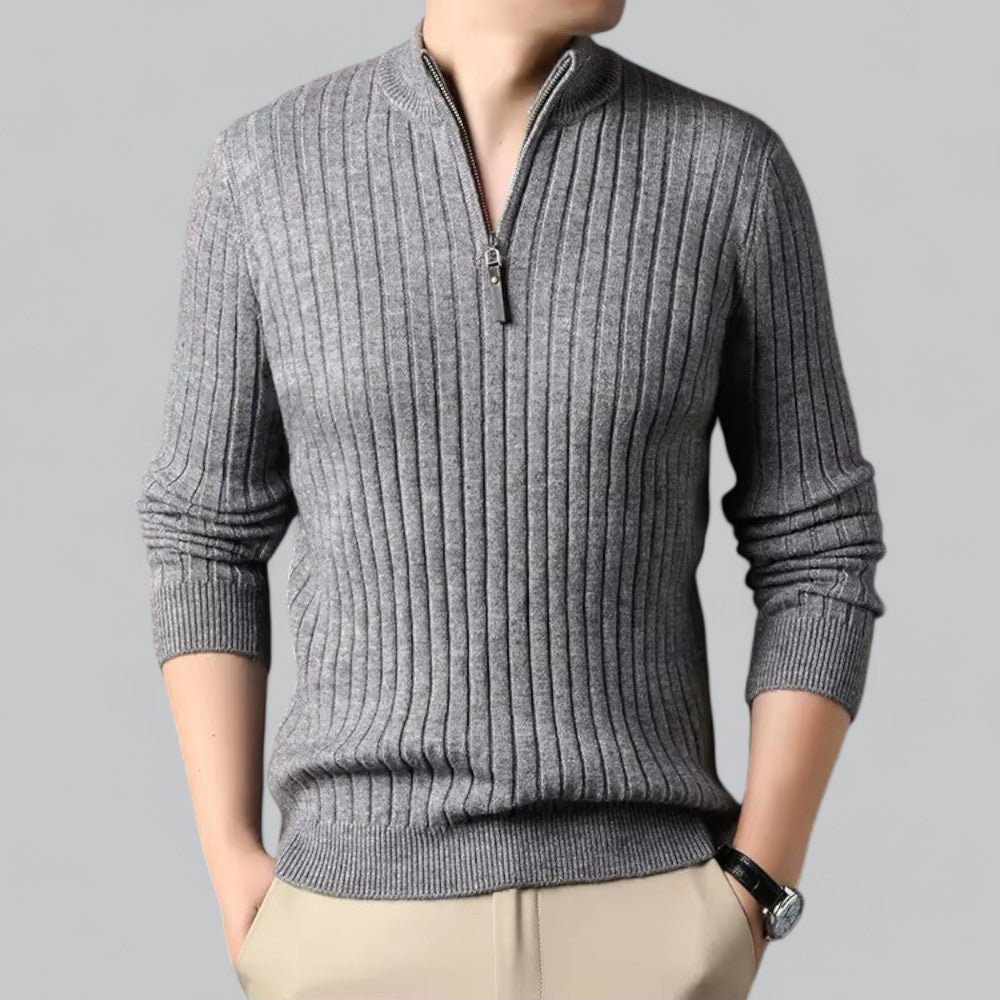 Gray ribbed sweater with a zipper on a gray background